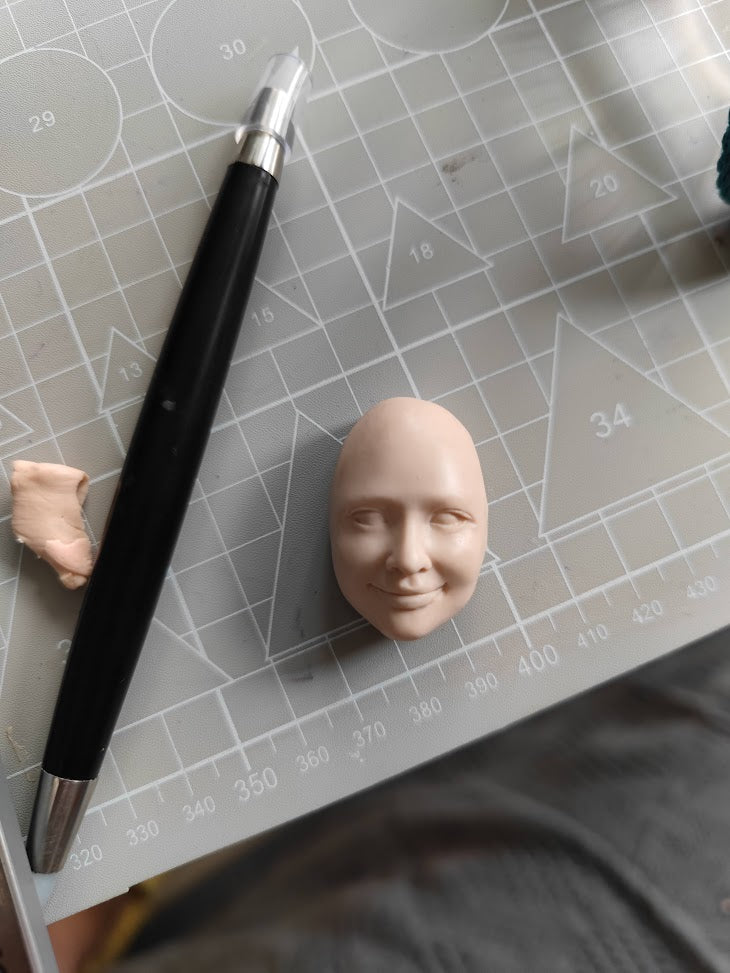 Close-up of a handcrafted figurine showing intricate details like facial expression, created by teacher goldfish yao in Goldfish Art’s clay sculpting and character modeling course for ages 5-18